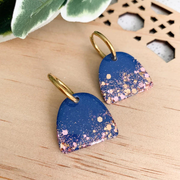 Arches Resin Earrings in navy with rose gold speckles and a huggie closure 