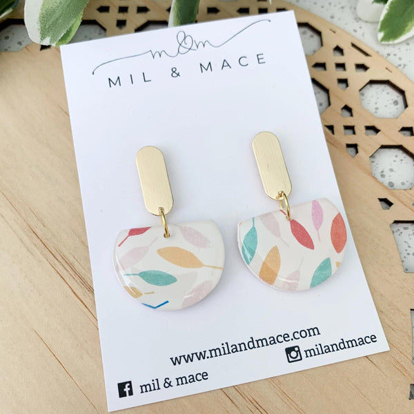 Leaves Clay Dangle Earrings with a leaf print in pink, green, mustard and terracotta. These earrings have a rectangle shaped gold metal stud