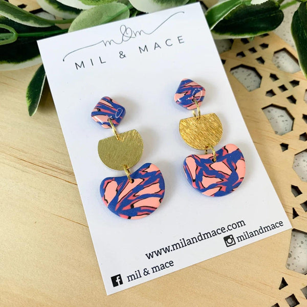 Leopard Clay Dangle Earrings with a blue and pink abstract print