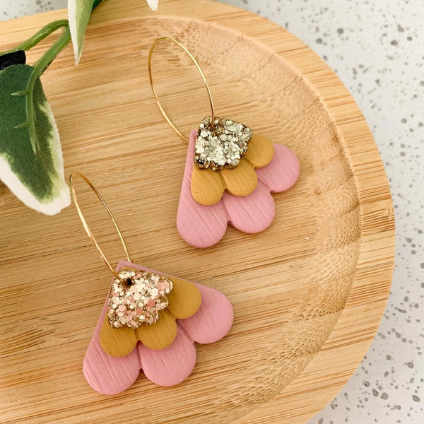 Petal Clay Dangle Hoop Earrings with a pink clay shaped petal and a gold resin petal with a gold hoop