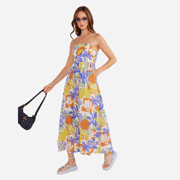 This sundress features a square neckline, thin adjustable shoulder straps and a full midi length skirt.