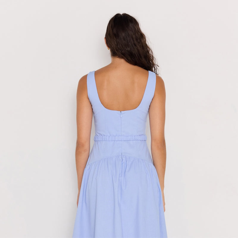Upper back view of the dress - it has a square neckline, invisible back zip and the curved detailing extends to the back of the dress (along the hips/waist).