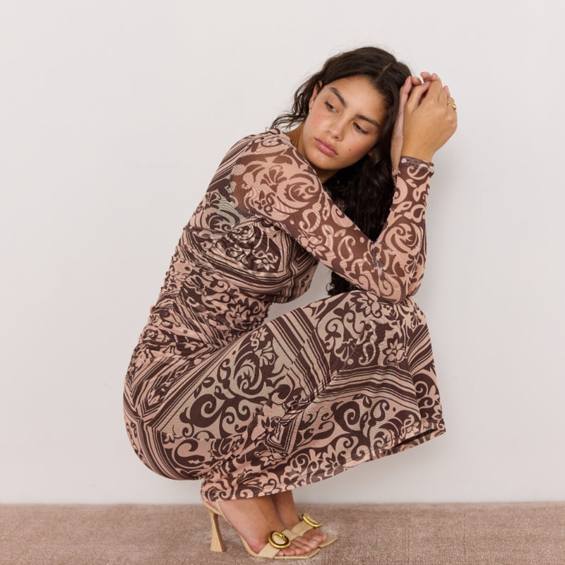 This dress has ruching down the side of the waist.
