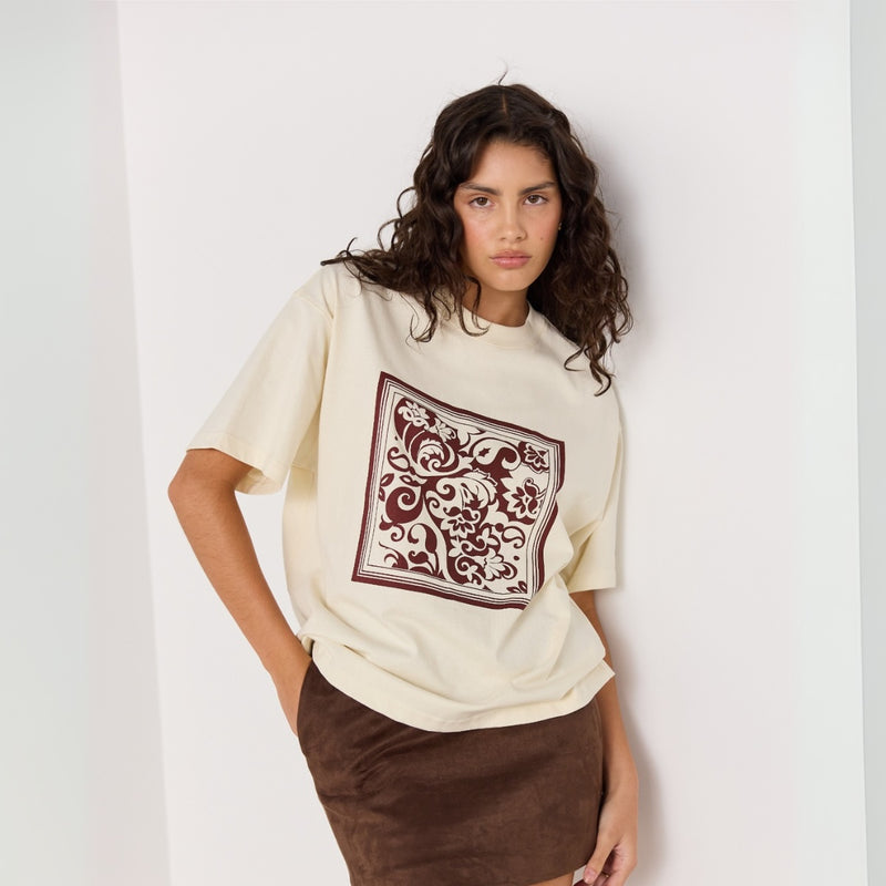 The tee has a round neckline, short sleeves and a boxy fit.