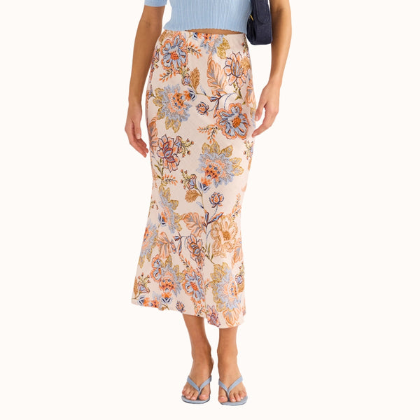 With an exclusive floral print in blue, peach, green and blue tones, our Marceline Bias Skirt finishes midi length.