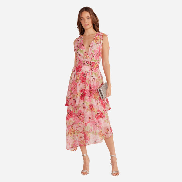 Our Simone Floral Dress has a pretty pink floral print and features a V neckline and a tiered midi skirt.