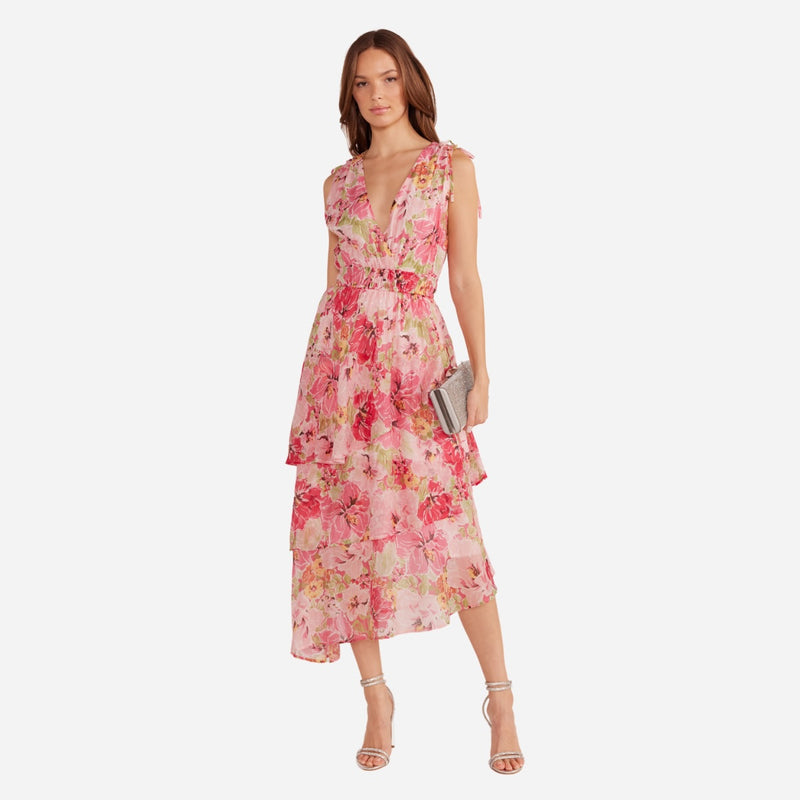 Our Simone Floral Dress has a pretty pink floral print and features a V neckline and a tiered midi skirt.