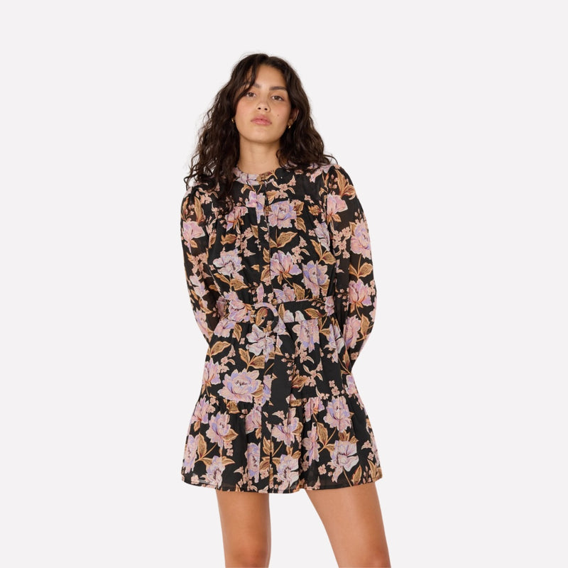 The mini dress has a mock collar, button front, long sleeves and a frill hem.