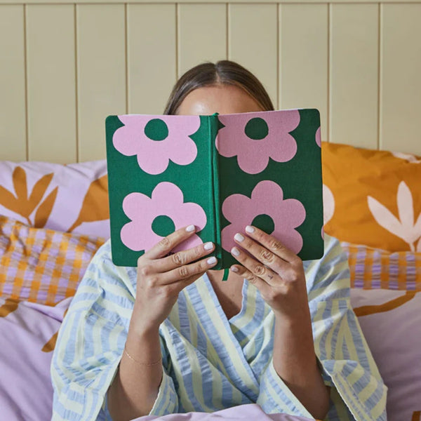 Our Mosey Me Flowerbed A5 Notebook has an original pink and green flowerbed artwork design.