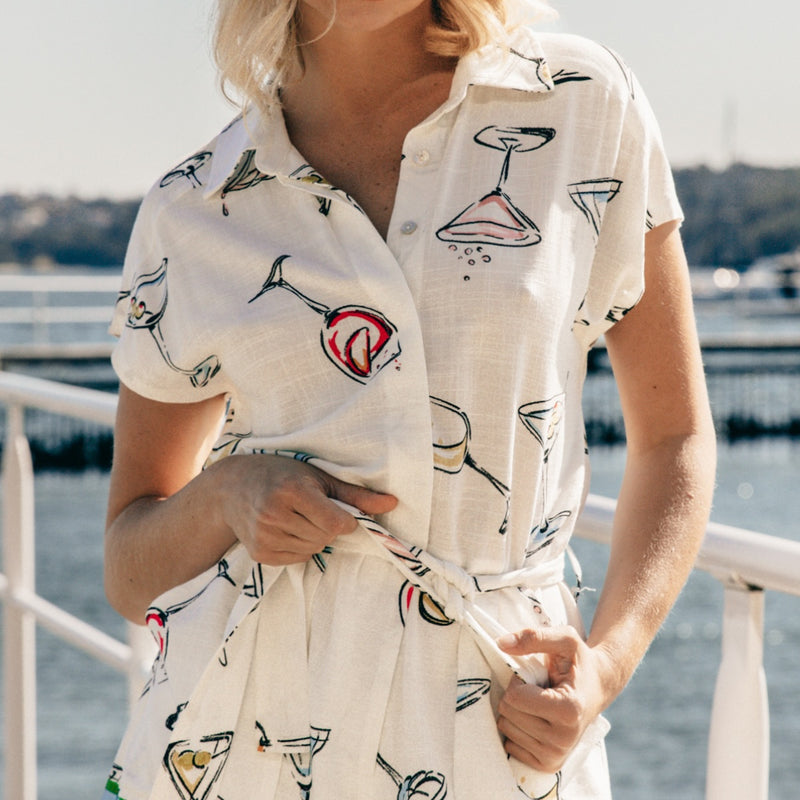 Close up of the bodice area - the print has cute illustrations of cocktail glasses and wine glasses.