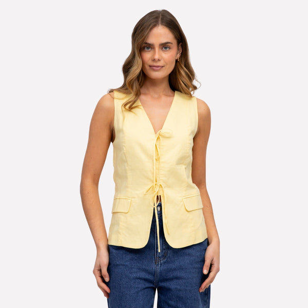 Our Drew Vest has a V neckline, tie closure on the front and faux pockets.