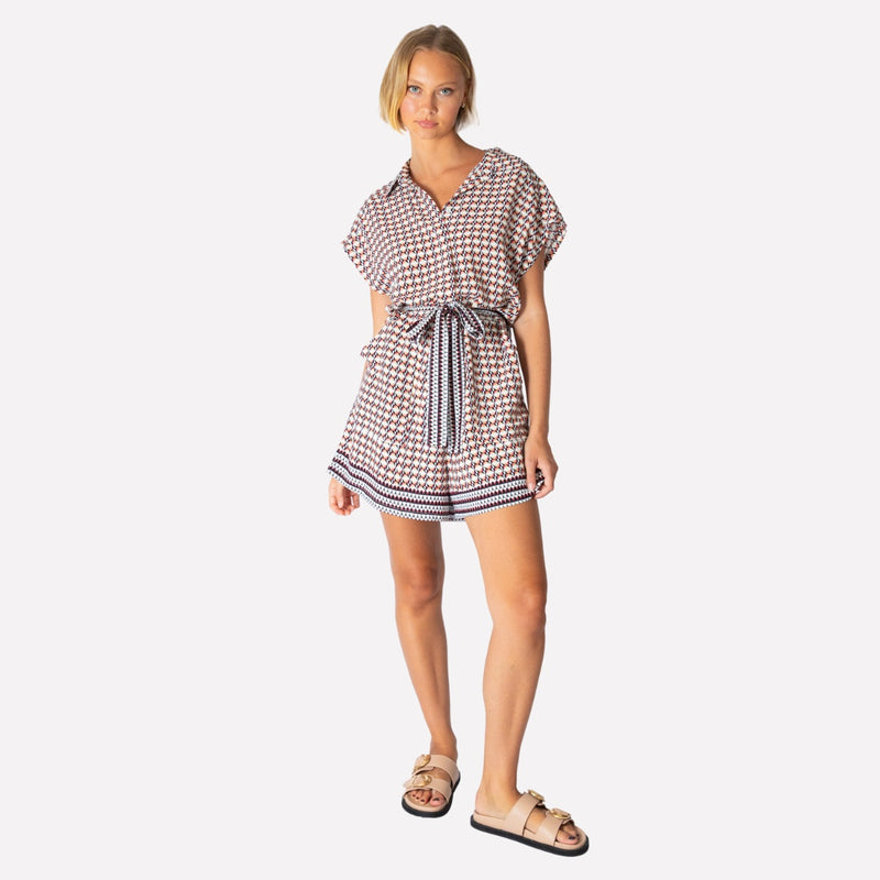Helsinki Geo Playsuit has short sleeves, a button front, self tie belt and shorts