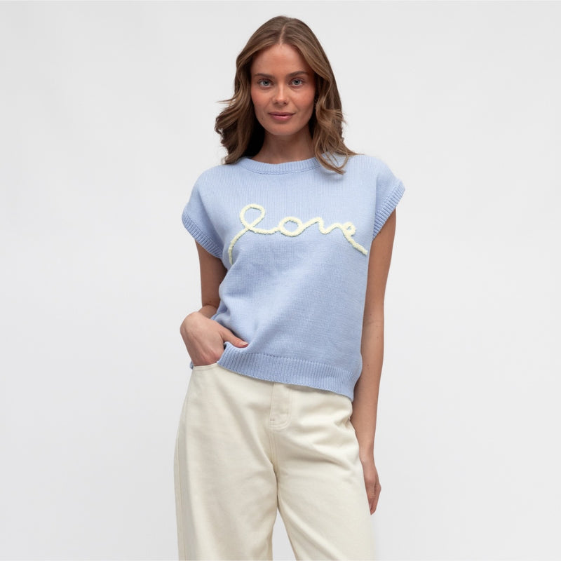Our Love Knit Vest is available in a pale blue colour with the word 'LOVE' stitched on the front in a pale yellow colour.