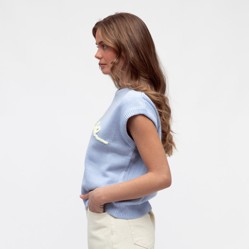 Side view of the knitted top.