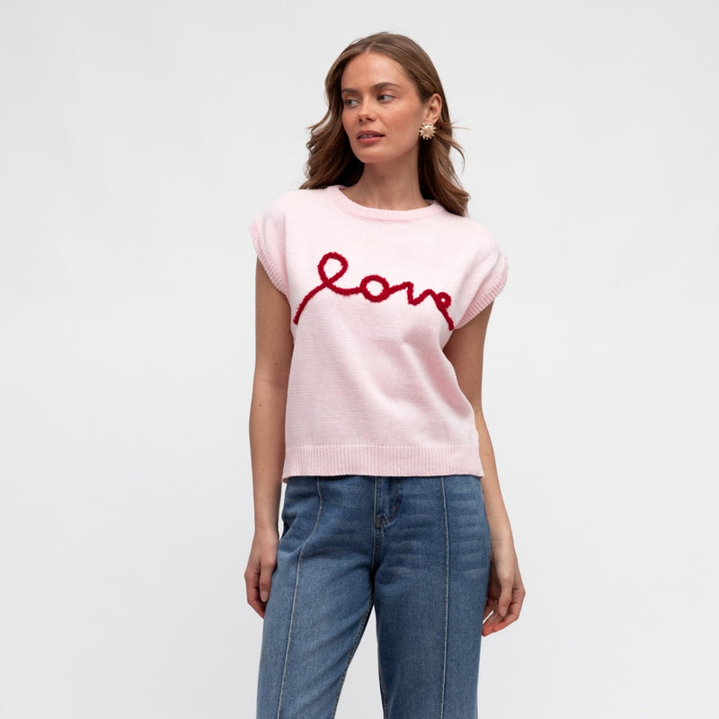 Love Knit Vest in pink with the word LOVE stitched in red on the front.