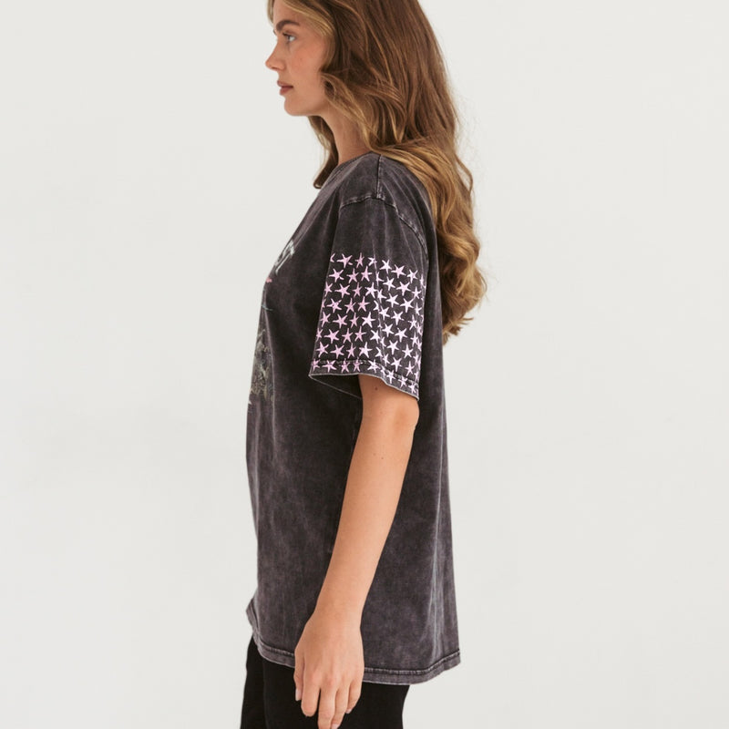 Side view of the tee and the pink stars on the sleeve.