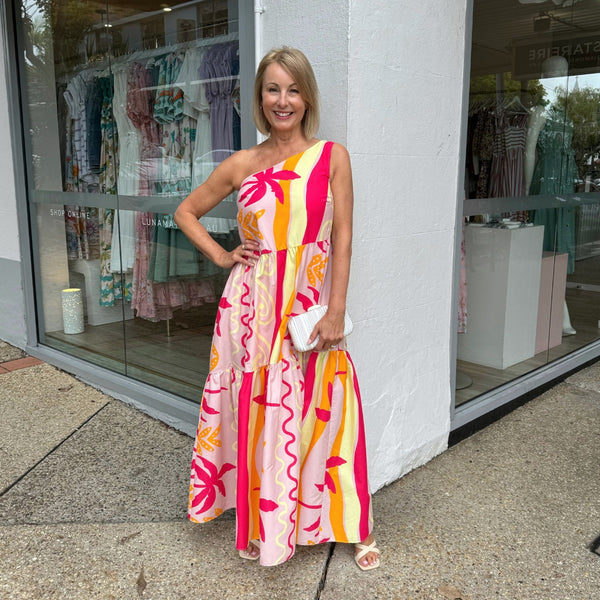 Meilani One Shoulder Dress with a fun vacay inspired print (pink, orange and yellow).