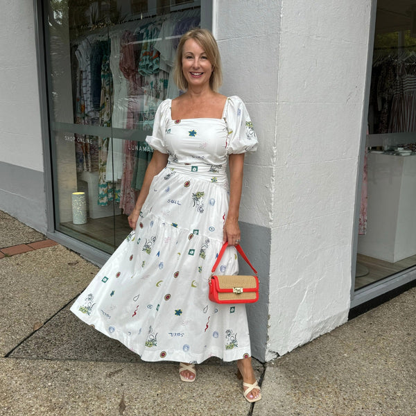 Our Soleil Ruched Dress has a fun tropical illustrations and its maxi length.