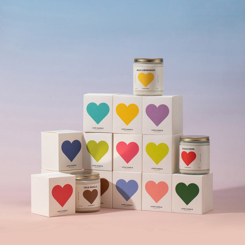 The candles are packaged in boxes with colourful hearts.