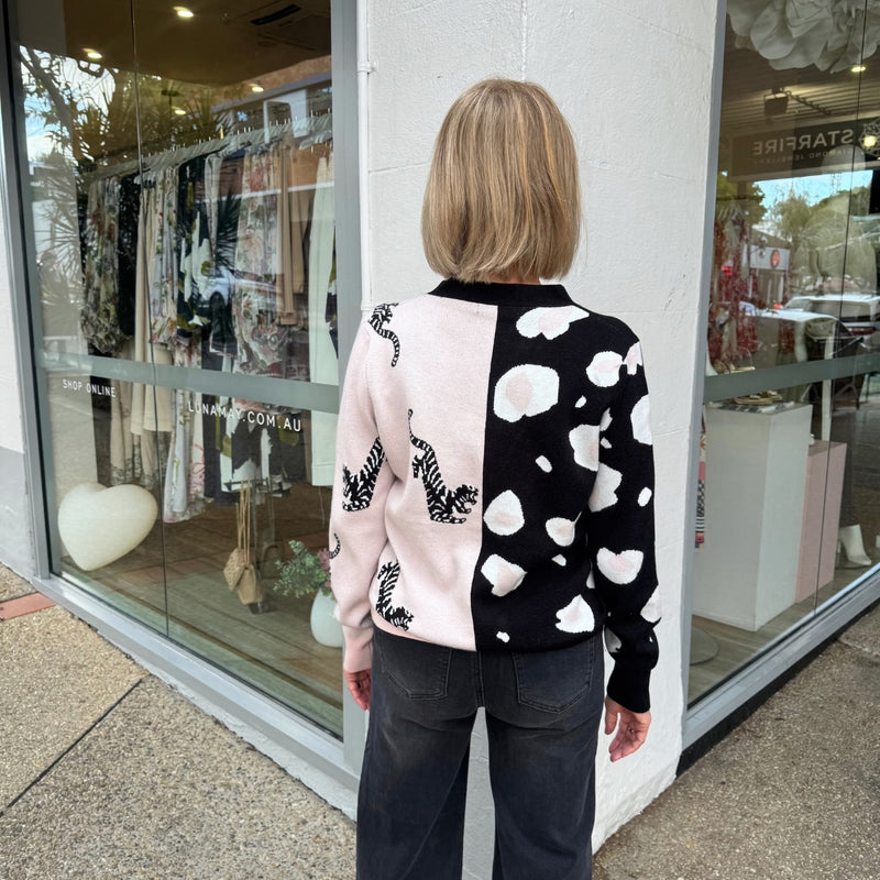 Back view of the cardigan with the spliced leopard print. 