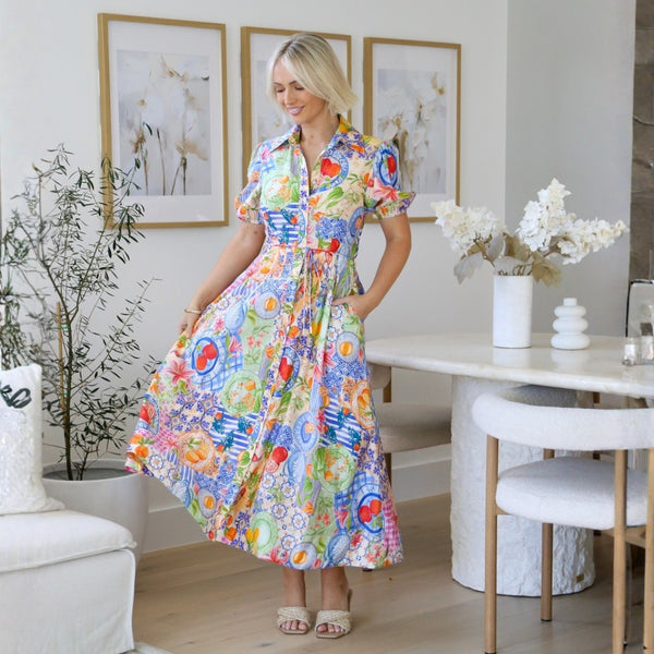 Aarna Midi Dress in a blue multi print featuring oranges and lemons to name a few.