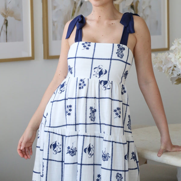 Close up of the bodice area and the navy tie shoulder straps.