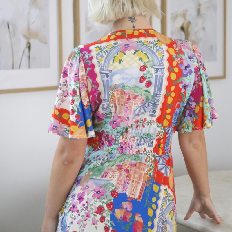 Close up of the upper back - it has a shirred panel on the back waist.