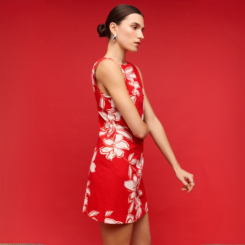 Another side view of the red floral mini dress.