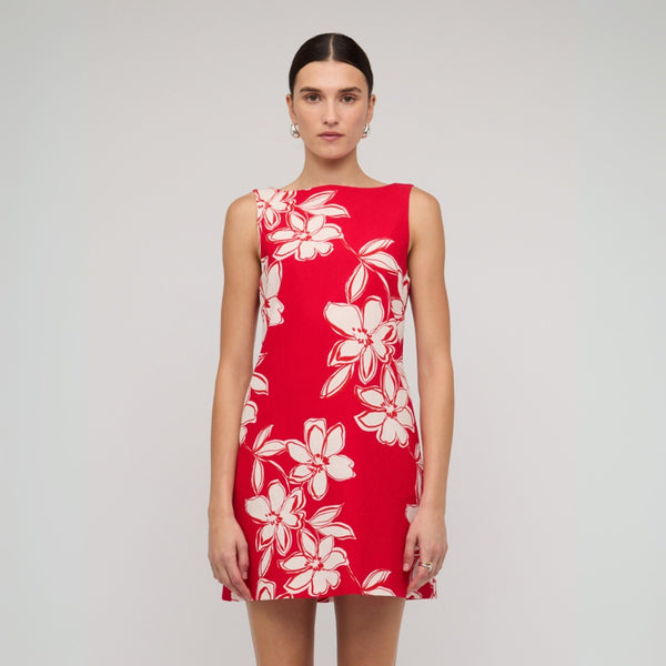 This sleeveless red mini dress features an extended neckline (front).