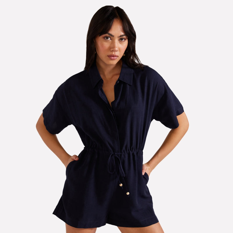 This playsuit is made from a linen blend fabric and it has short sleeves, drawstring waist and shorts