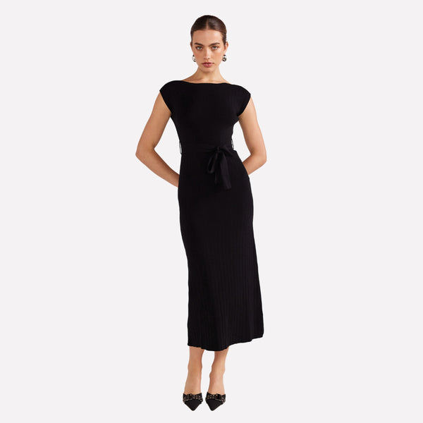 Our Luana Knit Dress is stylish. This black knit dress features a boat neckline, cap sleeve and a midi length skirt