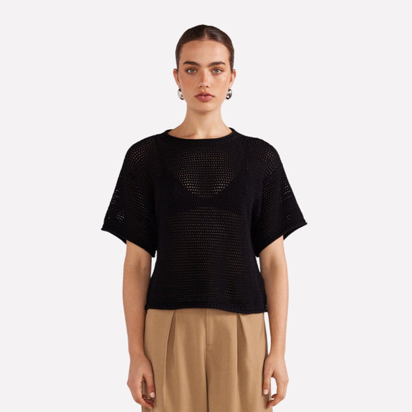 The top has a round neckline, half length sleeves and it has a boxy shape