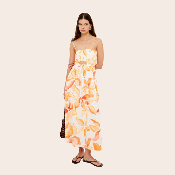 Solana Shirred Midi Dress with an orange and white print.