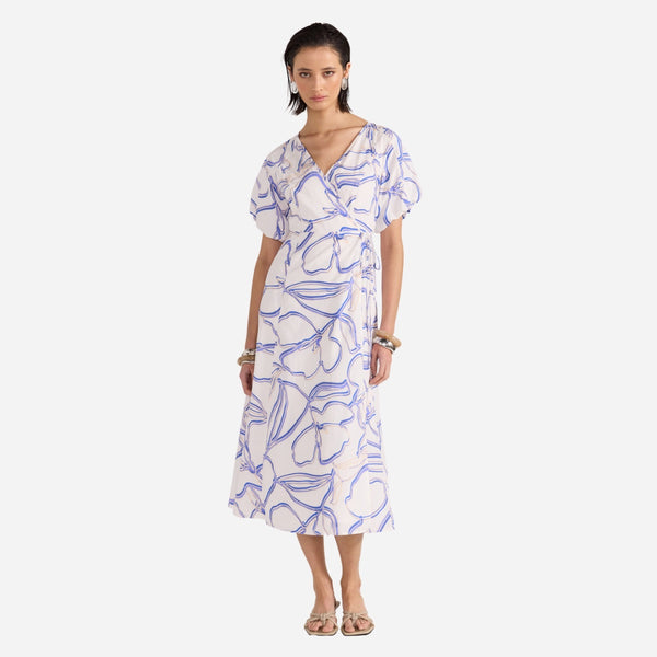 Our Soraya Floral Wrap Dress is in a blue, white and beige abstract print.