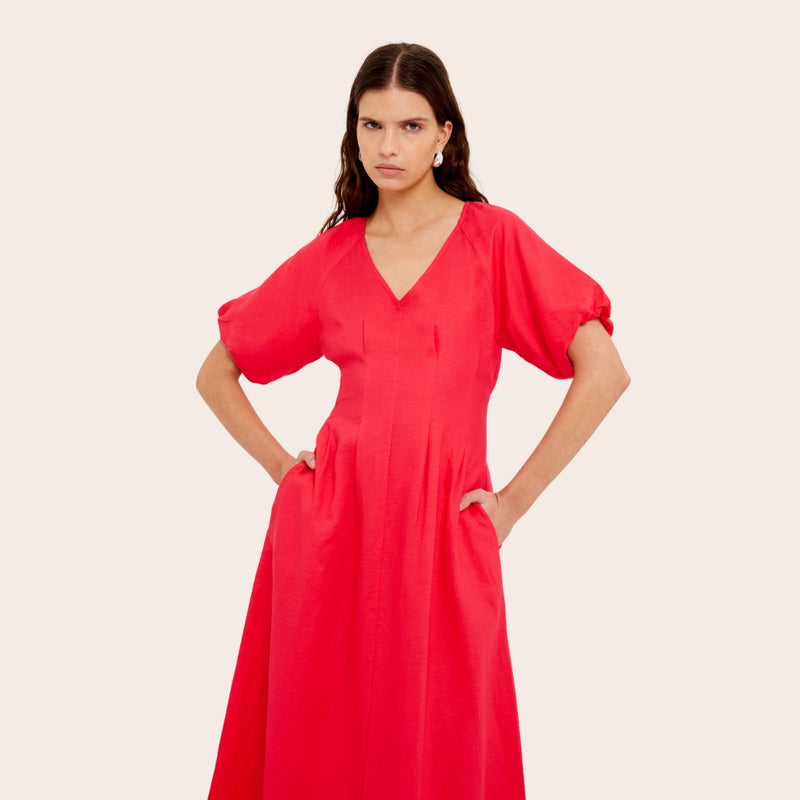 Close up of the bodice area - it has a V neckline, short puff sleeves and seam detailing extending down the waist.