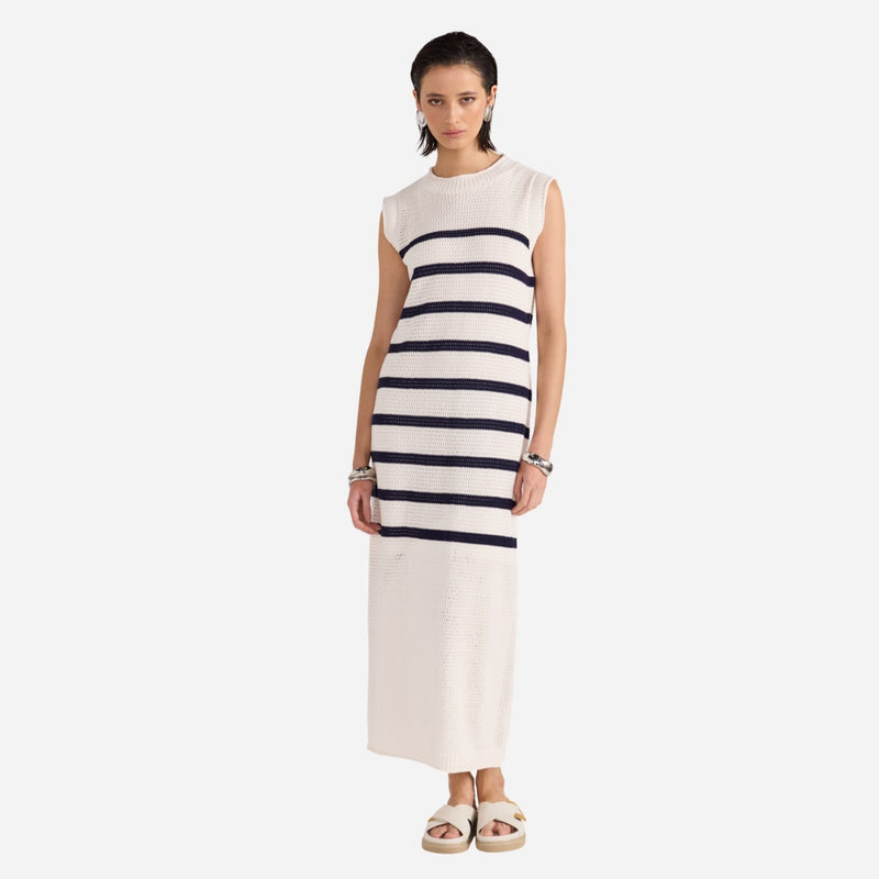 Our Veda Stripe Knit Dress has a white base and navy stripes horizontally from the bust to mid thigh.