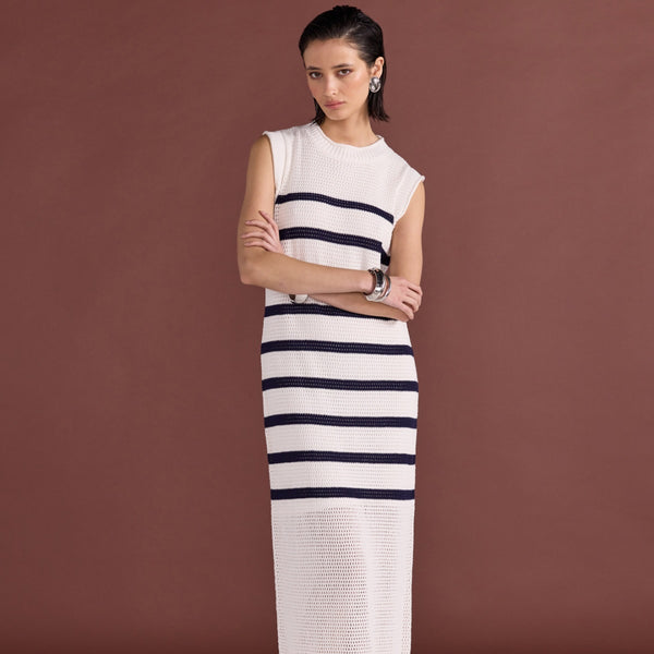 This sleeveless dress has a ribbed neckline, sleeve edge and its semi sheer from mid-thigh.