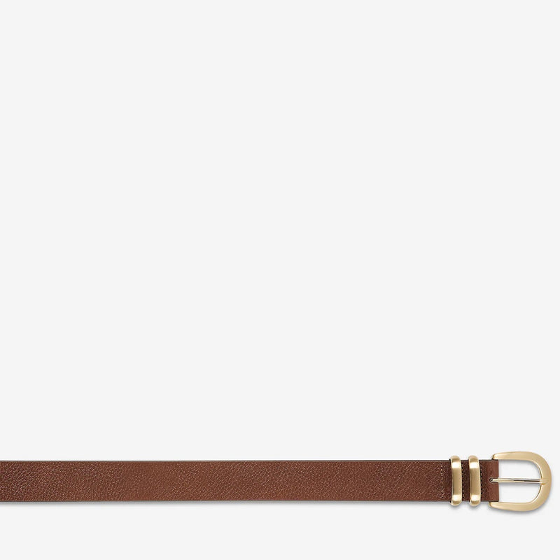 This narrow belt comes in a lovely tan colour.