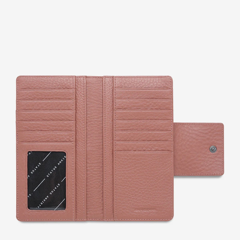 The wallet has card compartments and space for notes.