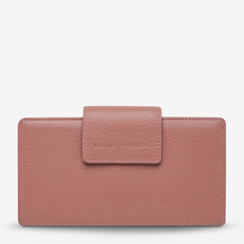The wallet has a fold over closure.