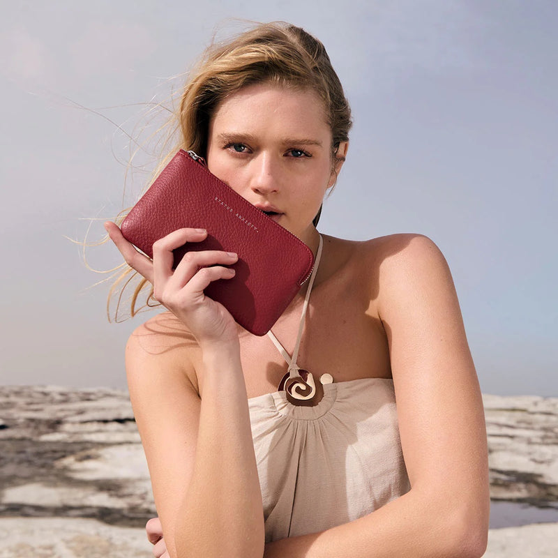 Model carrying the leather wallet.