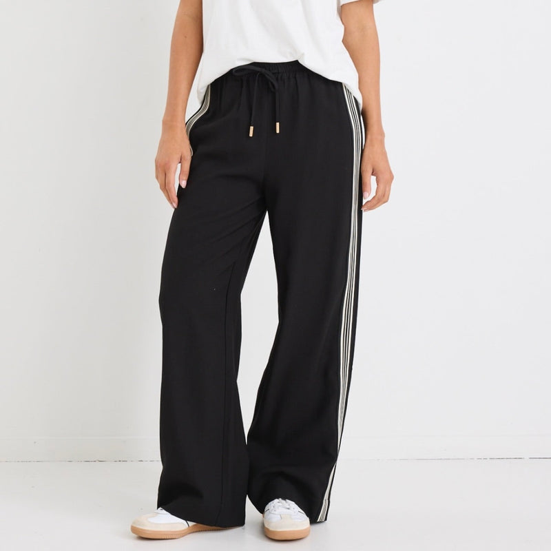 These Vibe Jacquard Pants are available in black with black and white side stripes.