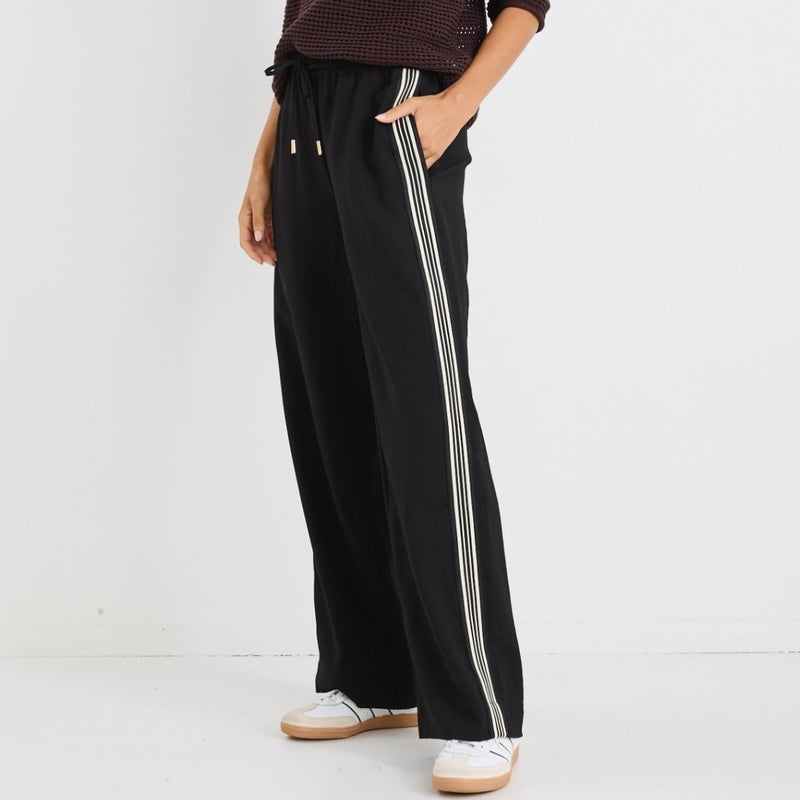 Side view of the pants and the black and white jacquard stripe on the outer leg.