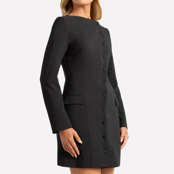 Features a round neckline, long sleeves, asymmetric button front and front pockets.