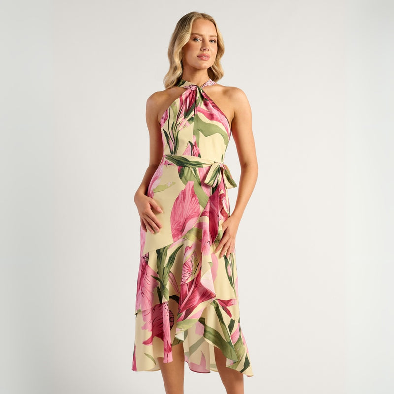 This stunning dress has a floral print in lemon, green and pink tones. It features a halter neck, detachable waist tie and a waterfall hemline.