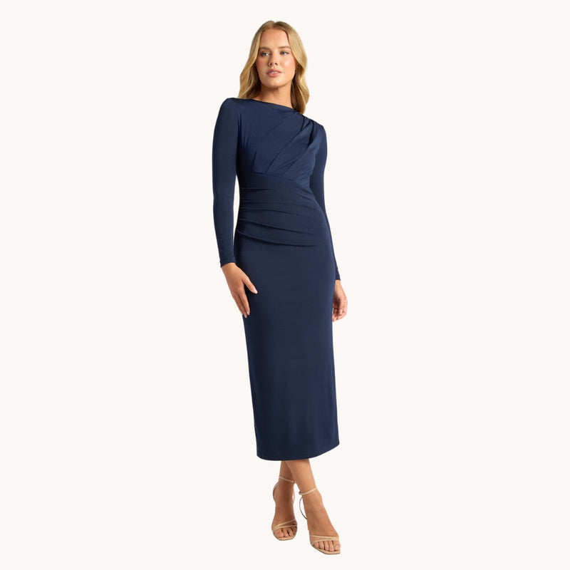 Our Solange Ruched Midi Dress is a body con style and is available in a navy colour. 