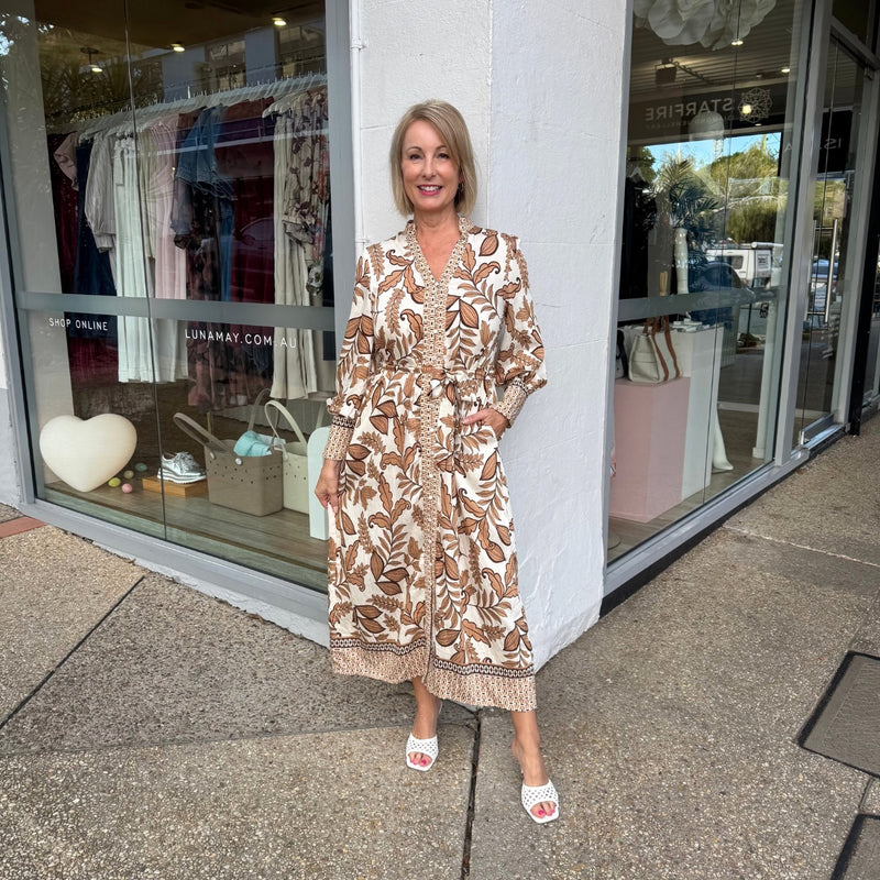 This midi length dress also has side pockets.