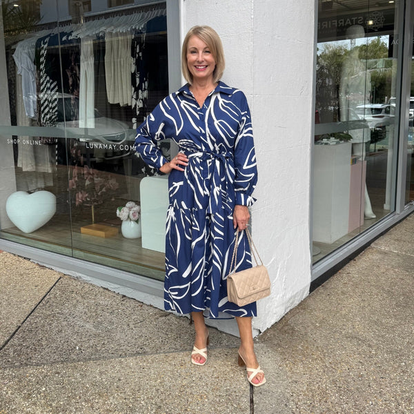 Our Carmine Shirt Dress is available in a navy and white abstract print.