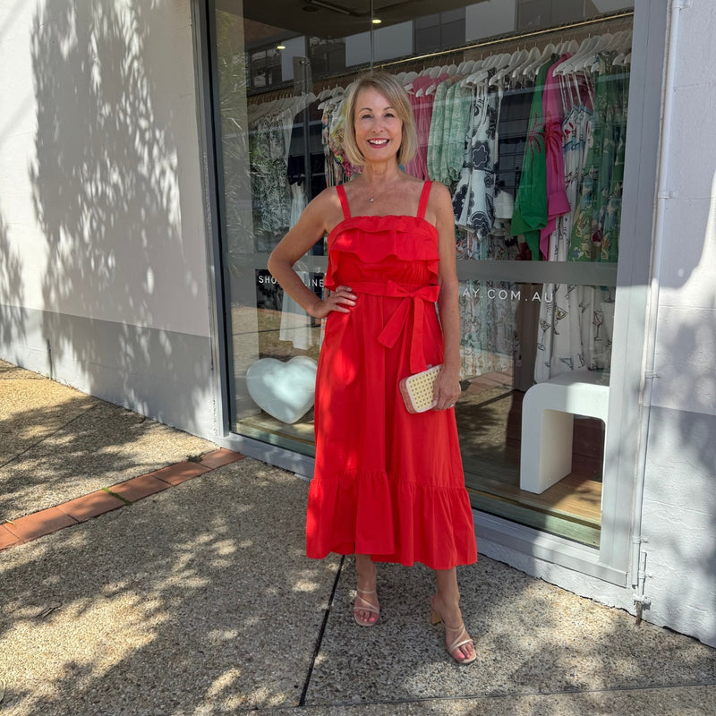 Accessorise with a clutch and heels.