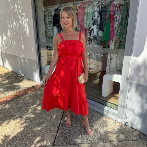 This red dress has a full midi length skirt with a frill hem.